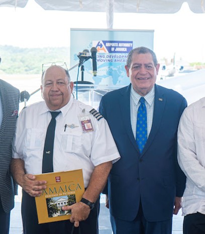 Director of Tourism, Jamaica Tourist Board, Donovan White shares the lens with QCAS Captain Nidio Hernandez, The Honorable Audley Shaw, Minister of Transport and Mining, Jamaica, and the Honorable Robert Montague, Member of Parliament for St. Mary Western, at the Ian Fleming International Airport in Ocho Rios.