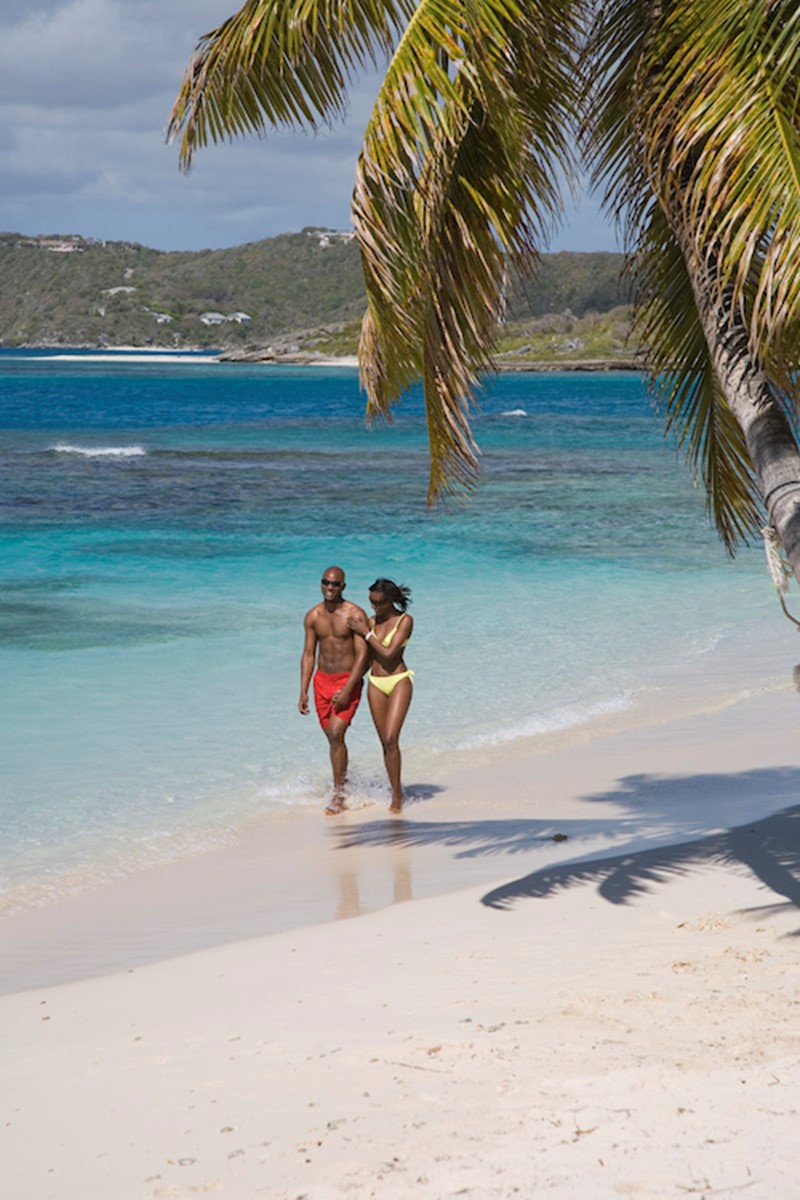 Tourists on Antigua and Barbuda beach
