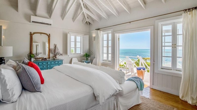 A bedroom overlooking a Bahamas beach