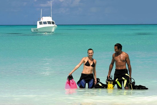 Two Scuba Divers returning from a dive in Antigua